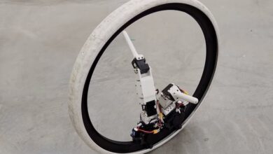 Star-Wars-inspired robot rolls on a round body and uses legs to steer