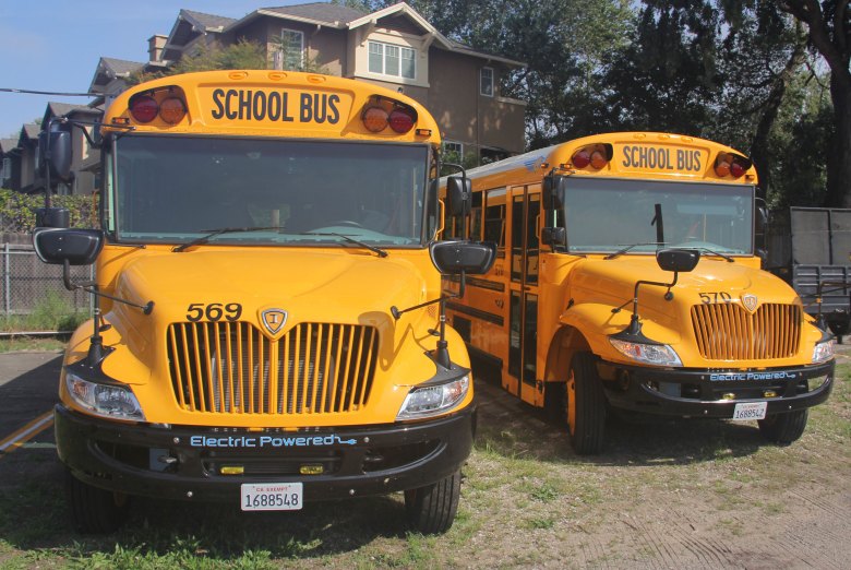 The Goleta Union School District’s brand-new electric buses parked in front of their charging station, sporting a fresh coat of the federally required paint color, “National School Bus Glossy Yellow.”