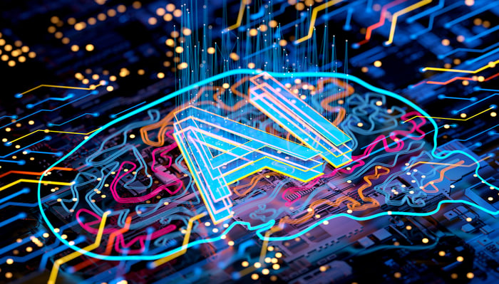 A graphic of a brain with the letters AI in the middle printed on a circuit board.