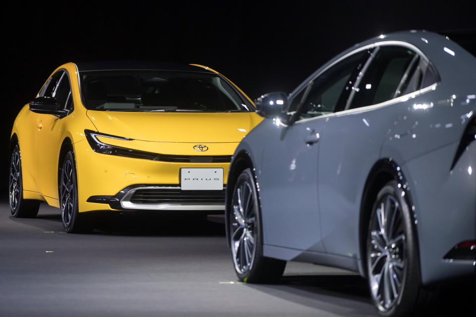 TOKYO, JAPAN - NOVEMBER 16: Toyota Motor Corp.'s Prius 2.0L plug-in hybrid electric vehicle (PHEV) prototype, left, and Prius 2.0L hybrid electric vehicle (HEV) prototype are displayed during the World Premiere of the All-New Prius on November 16, 2022 in Tokyo, Japan. Toyota unveiled the fifth generation of its Prius hybrid on Wednesday, as competition in the electric vehicle market starts to heat up globally. (Photo by Tomohiro Ohsumi/Getty Images)