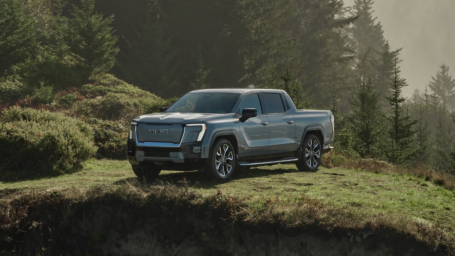 2024 GMC Sierra EV Denali Edition Exterior shot parked on a hill