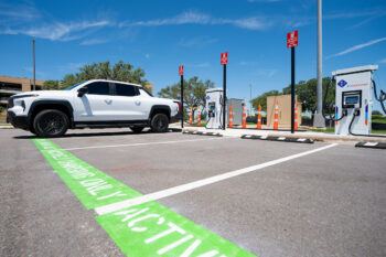 A white truck charging at one of the new Level 3 stations.