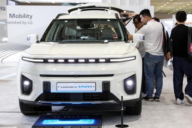 Visitors look at an electric car at KG Mobilitys booth at EVS37 at COEX in Seoul on April 24 2024 AJU PRESS Kim Dong-woo