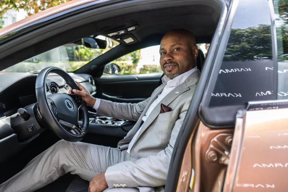 Karma CEO Marques McCammon sits on the driver’s seat on Wednesday of his company’s Karma Revero, a range-extended luxury electric vehicle manufactured in Southern California.