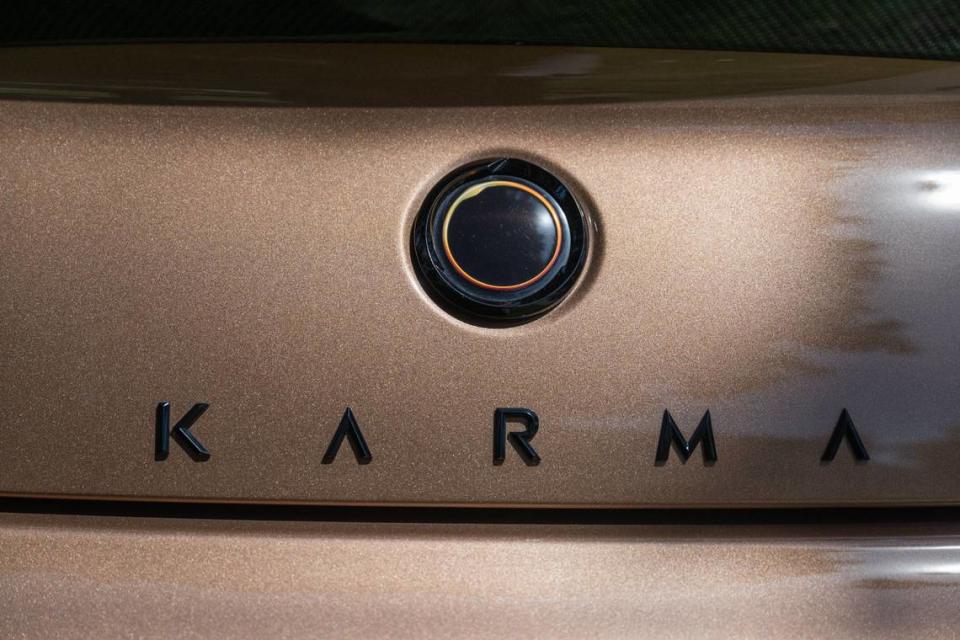 The logo for Karma vehicles is a solar eclipse, seen on a Karma Revero, a range-extended luxury electric on display at the Capitol on Wednesday.