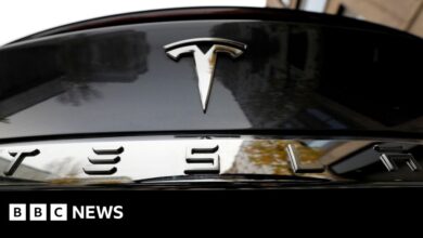 Tesla profits halve, more jobs axed, new models brought forward