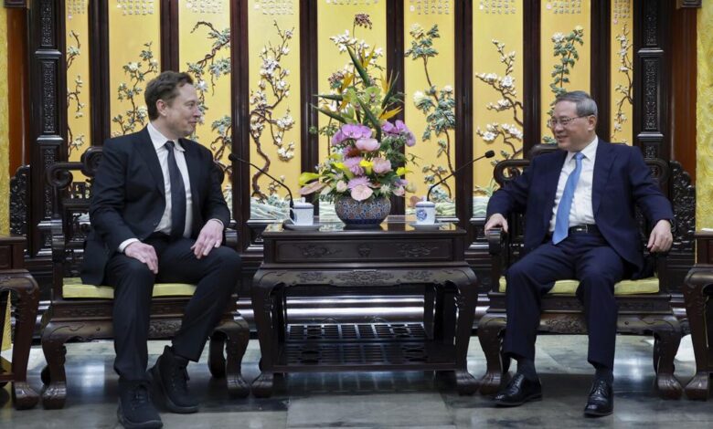 Tesla founder Musk visits China as competitors show off new electric vehicles at Beijing auto show | AP International News