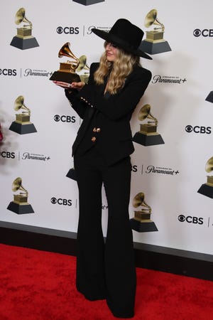 Feb 4, 2024; Los Angeles, CA, USA; Lainey Wilson, winner of Best Country Album for ‘Bell Bottom Country’ at the 66th Annual Grammy Awards at Crypto.com Arena in Los Angeles on Sunday, Feb. 4, 2024.. Mandatory Credit: Dan MacMedan-USA TODAY