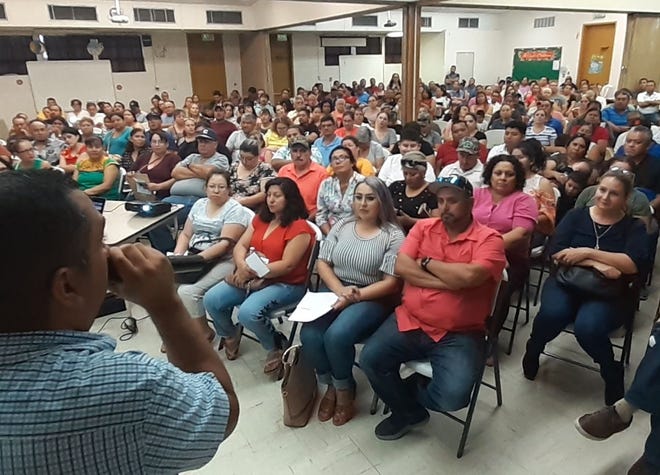 Reyes Lopez conducts a "Cómo iniciar tu negocio de comida" (How to start a food business) workshop at Coachella Catholic Church.