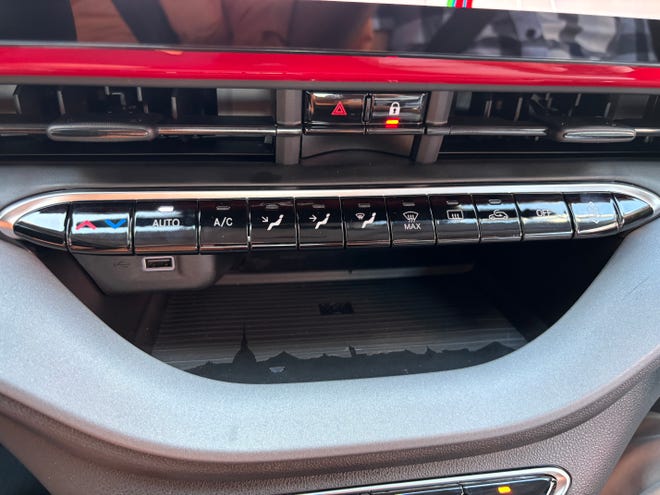The 2024 Fiat 500e mini-compact electric vehicle has physical controls for major climate functions.