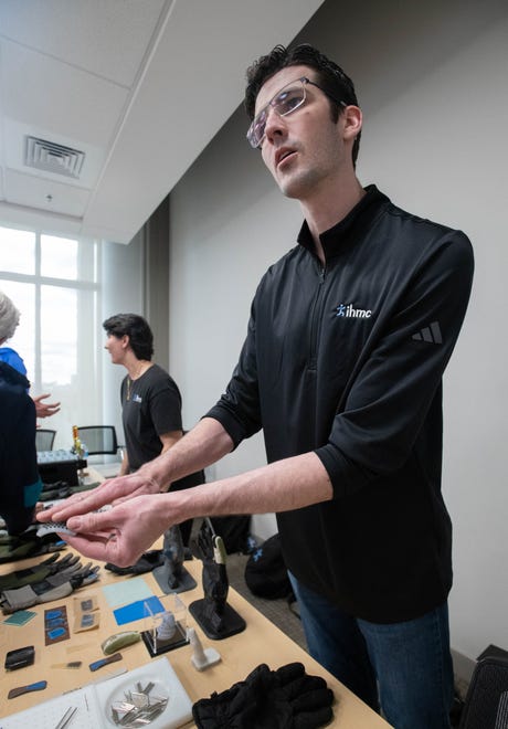 Research associate Landon Casey talks about tactile gloves during the IHMC open house in Pensacola on Thursday, April 11, 2024.