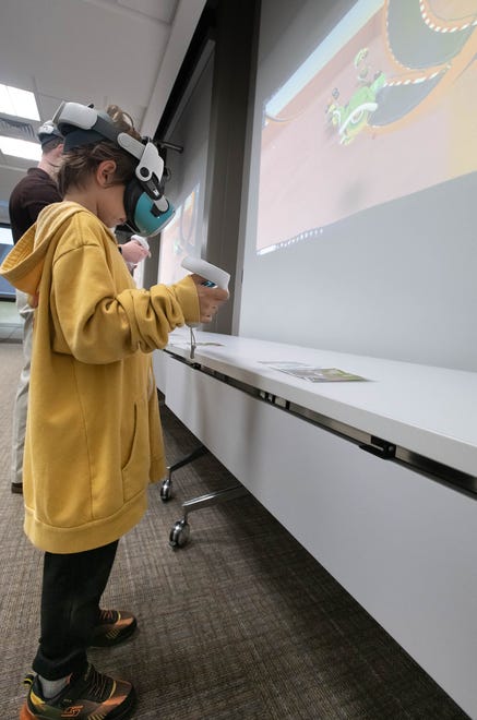 Nathan Colbert, 6, of McDavid, tries virtual reality equipment during the IHMC open house in Pensacola on Thursday, April 11, 2024.