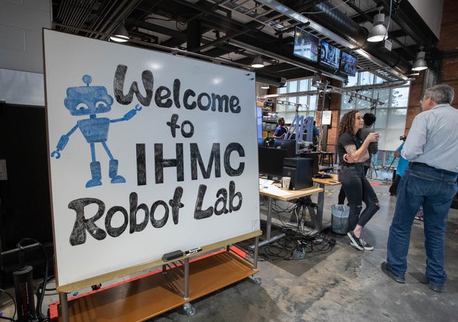 People tour the Robotics Lab during the IHMC open house in Pensacola on Thursday, April 11, 2024.