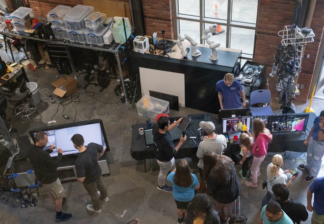 People tour the Robotics Lab during the IHMC open house in Pensacola on Thursday, April 11, 2024.