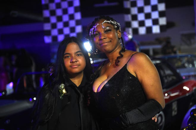 Sparks High students celebrate during their prom at the National Automobile Museum in Reno on April 27, 2024.