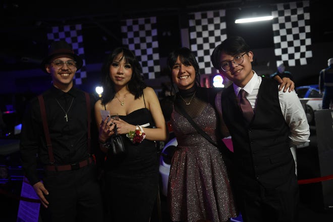 Sparks High students celebrate during their prom at the National Automobile Museum in Reno on April 27, 2024.