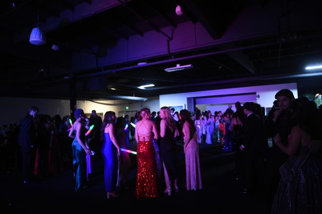 Sparks High students celebrate during their prom at the National Automobile Museum in Reno on April 27, 2024.