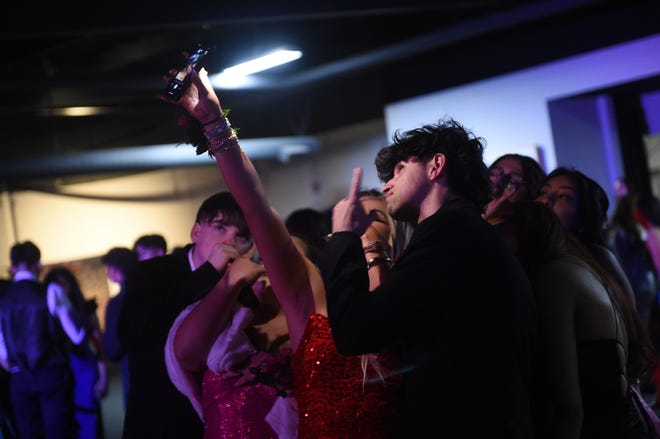 Sparks High students celebrate during their prom at the National Automobile Museum in Reno on April 27, 2024.