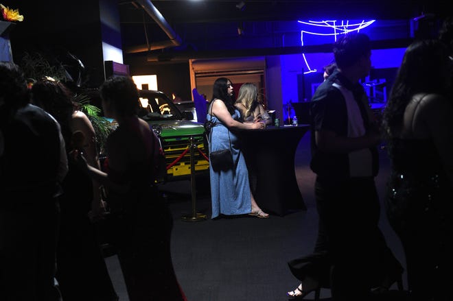 Sparks High students celebrate during their prom at the National Automobile Museum in Reno on April 27, 2024.