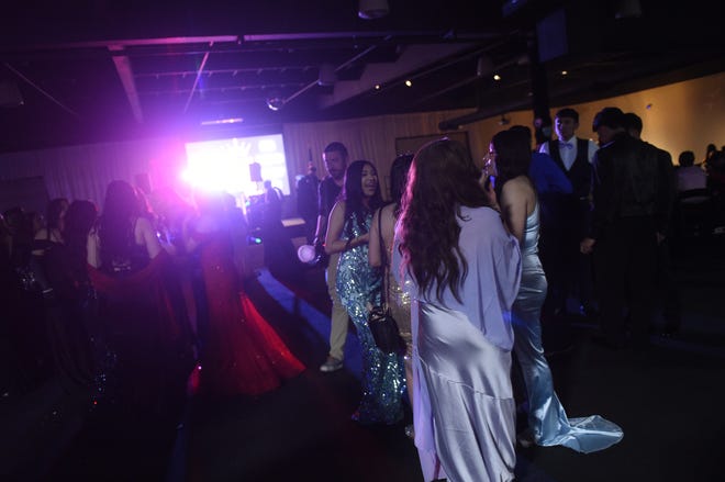 Sparks High students celebrate during their prom at the National Automobile Museum in Reno on April 27, 2024.