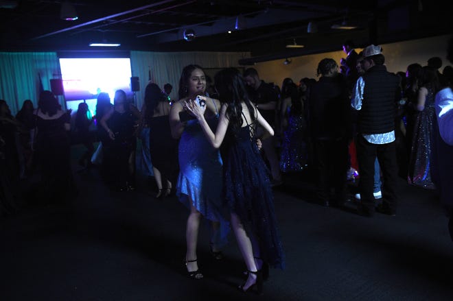 Sparks High students celebrate during their prom at the National Automobile Museum in Reno on April 27, 2024.