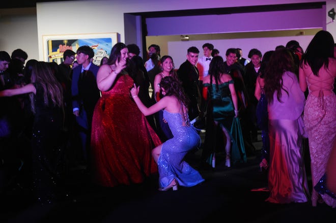 Sparks High students celebrate during their prom at the National Automobile Museum in Reno on April 27, 2024.