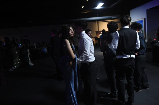 Sparks High students celebrate during their prom at the National Automobile Museum in Reno on April 27, 2024.