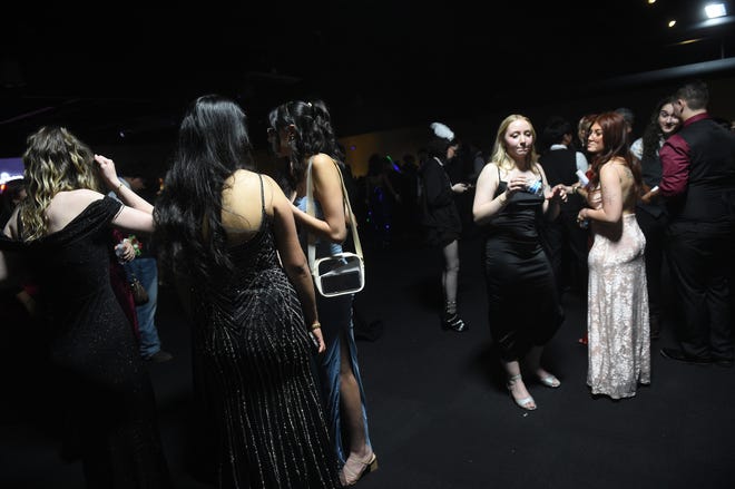 Sparks High students celebrate during their prom at the National Automobile Museum in Reno on April 27, 2024.