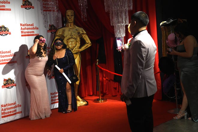 Sparks High students celebrate during their prom at the National Automobile Museum in Reno on April 27, 2024.