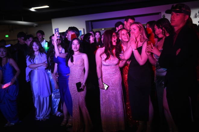 Sparks High students celebrate during their prom at the National Automobile Museum in Reno on April 27, 2024.