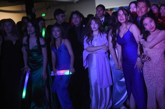 Sparks High students celebrate during their prom at the National Automobile Museum in Reno on April 27, 2024.