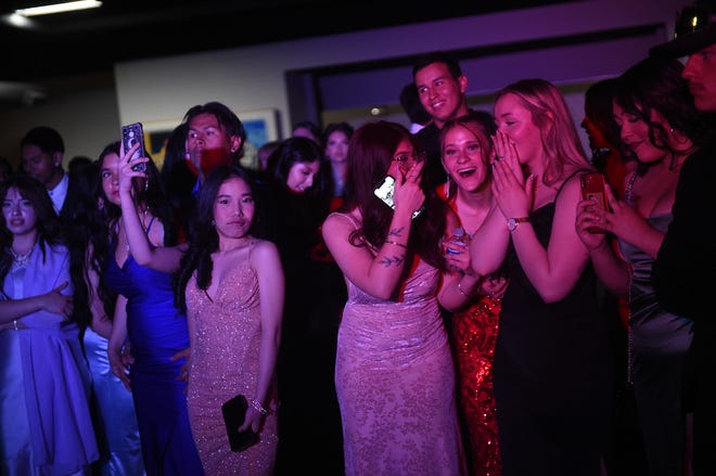 Sparks High students celebrate during their prom at the National Automobile Museum in Reno on April 27, 2024.