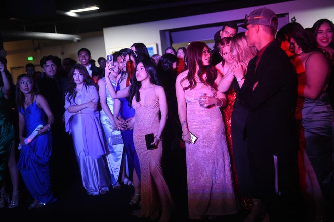 Sparks High students celebrate during their prom at the National Automobile Museum in Reno on April 27, 2024.