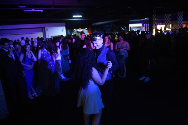 Sparks High students celebrate during their prom at the National Automobile Museum in Reno on April 27, 2024.