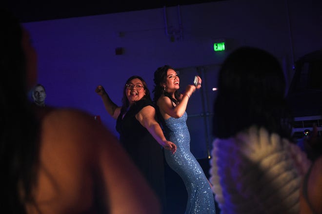 Sparks High students celebrate during their prom at the National Automobile Museum in Reno on April 27, 2024.