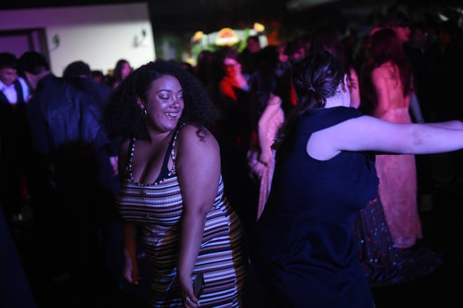 Sparks High students celebrate during their prom at the National Automobile Museum in Reno on April 27, 2024.