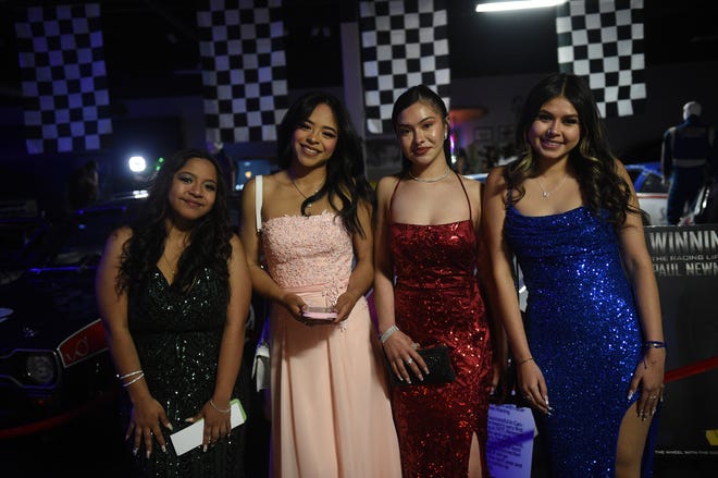 Sparks High students celebrate during their prom at the National Automobile Museum in Reno on April 27, 2024.