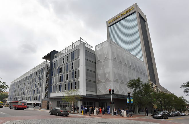 The new VyStar parking garage along Forsyth Street where it intersects with Laura Street in the core of downtown Jacksonville opened Tuesday morning, April 4, 2023. The new structure has 759 parking spaces, and currently houses the Jacksonville Children's Chorus. VyStar announced that three more tenants will fill the rest of the street level commercial space. OneJax and Level the Playing Field Leadership Academy are two nonprofits that will be moving in and in the large space at the intersection of Forsyth Street and Laura Street, the Pour Taproom will be setting up their self-serve taproom.