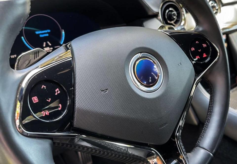 The steering wheel of the Karma Revero features the company’s eclipse logo and buttons to control phone, music and cruise control.