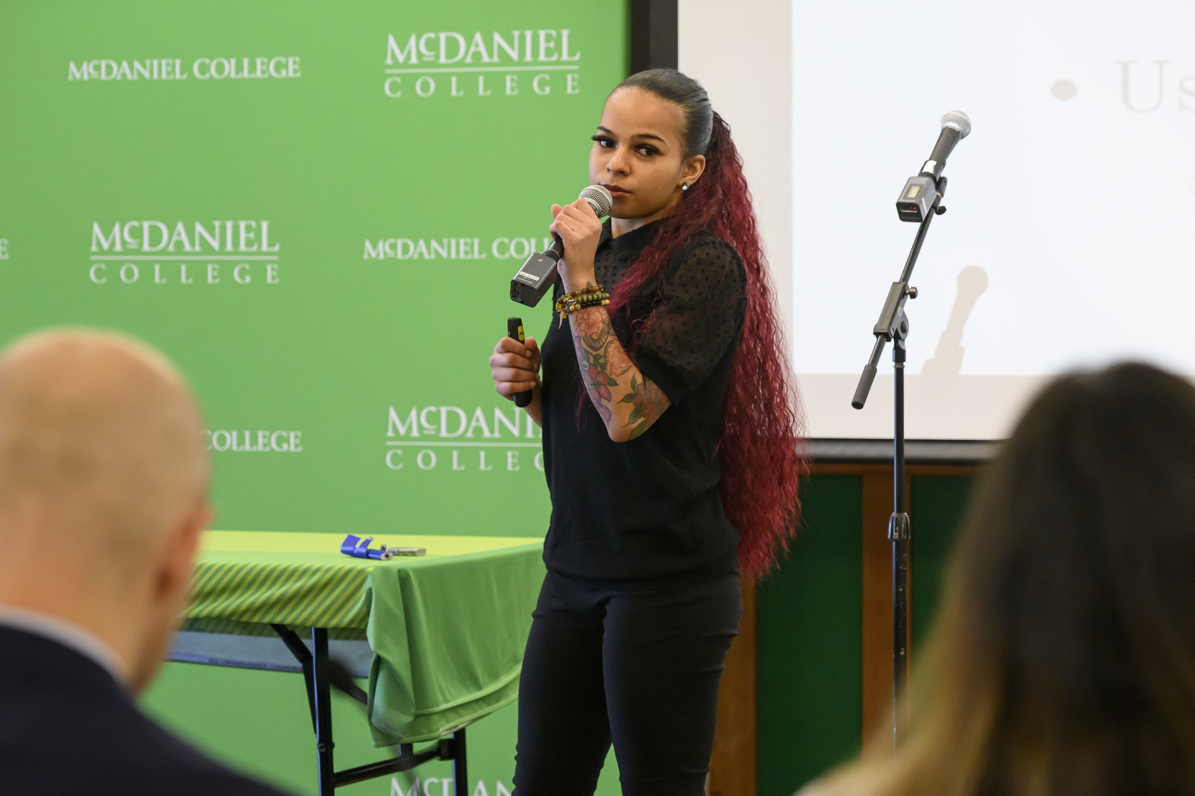 Lauren Dixon presents her idea FyFence, a wind blocker for lighter flames, during the Innovation and Entrepreneurship Challenge at McDaniel College. (Thomas Walker/Freelance)