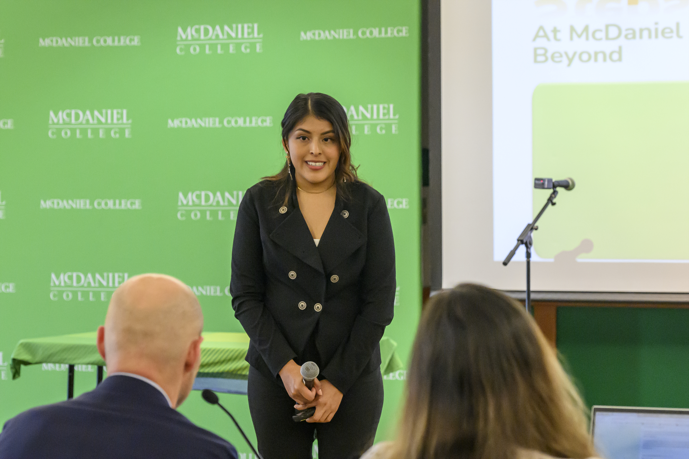 Melissa Torres listens as a judge asks her a question about her ideas during the Innovation and Entrepreneurship Challenge at McDaniel College. (Thomas Walker/Freelance)