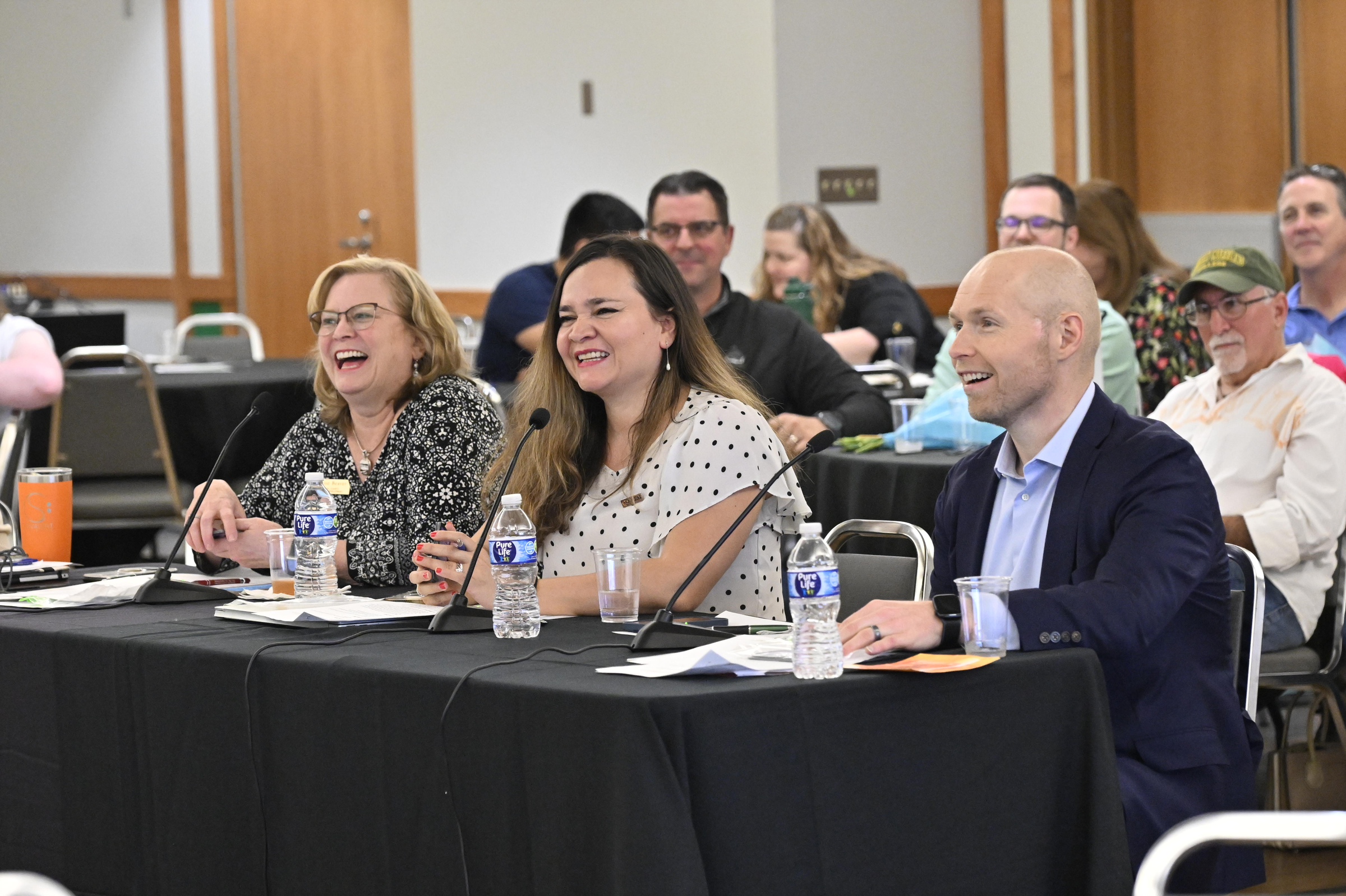 Judges, from left to right, Denise L. Beaver, Karen Zuccardi, and Jason Stambaugh react to Josiah Yung's presentation during the Innovation and Entrepreneurship Challenge at McDaniel College. (Thomas Walker/Freelance)