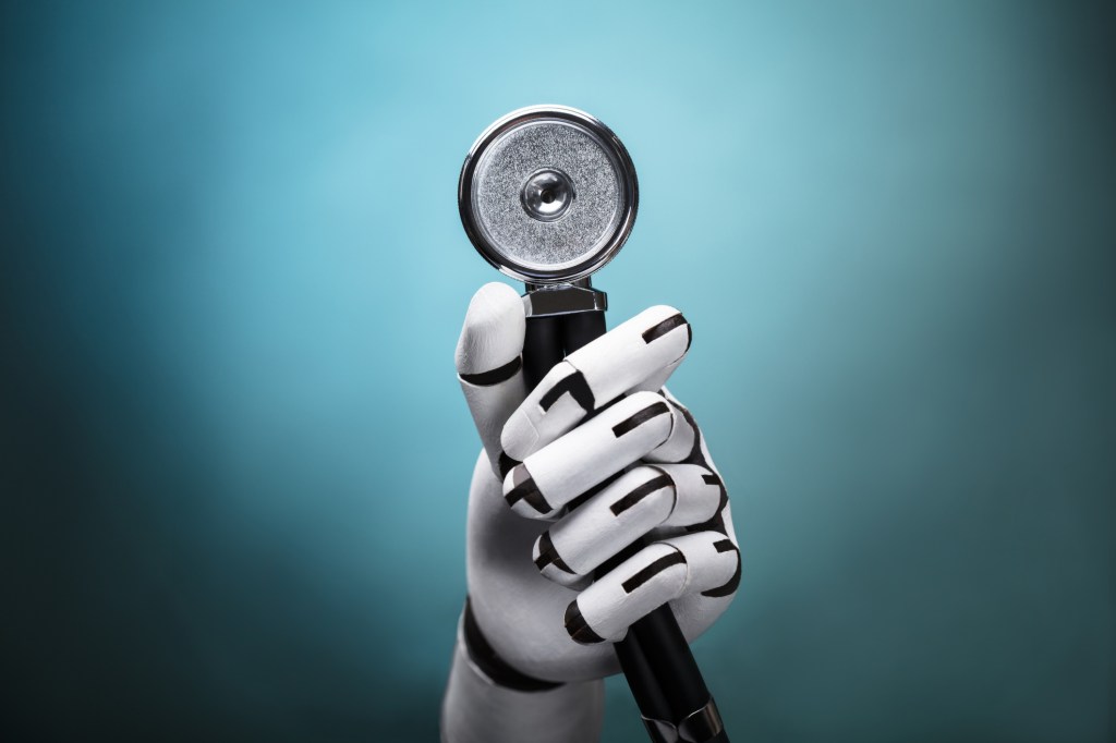 Close-up Of A Robot's Hand Holding Stethoscope; healthcare automation