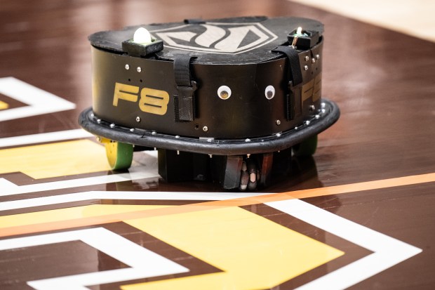 A Valparaiso University robotic football defender robot rolls through the end zone during a game against Ohio Northern University in the 11th annual Collegiate Robotic Football Conference in Valparaiso on Saturday, April 13, 2024. (Kyle Telechan/for the Post-Tribune)