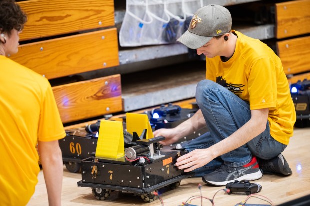 Valparaiso University robotic football build team members perform maintenence on the team's robots before facing off against Ohio Northern University in the 11th annual Collegiate Robotic Football Conference in Valparaiso on Saturday, April 13, 2024. (Kyle Telechan/for the Post-Tribune)