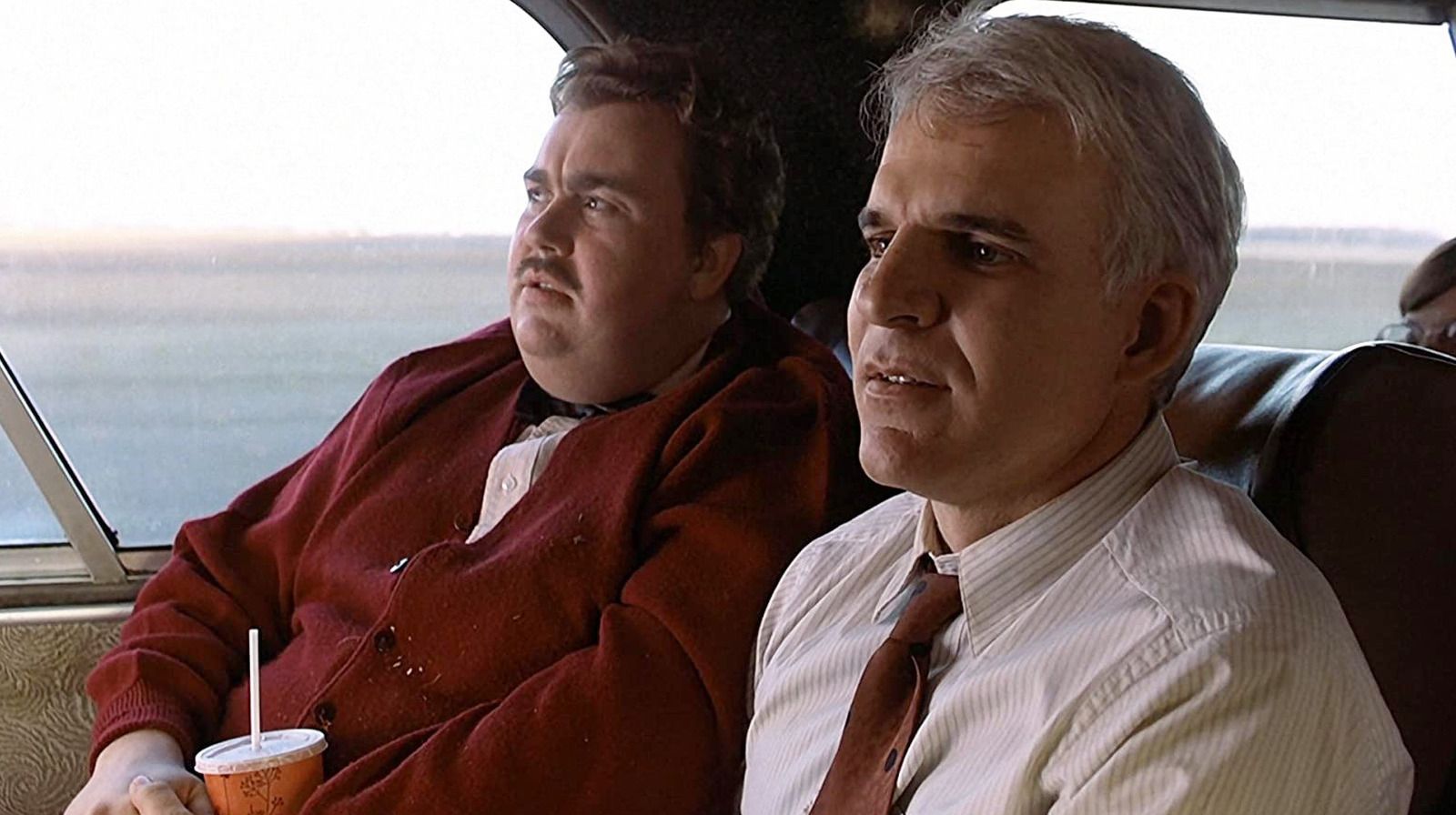 Planes Trains and Automobiles-John Candy as Del Griffith & Steve Martin as Neal Page