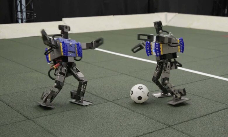 Watch mini humanoid robots showing off their football skills Watch mini humanoid robots showing off their football skills