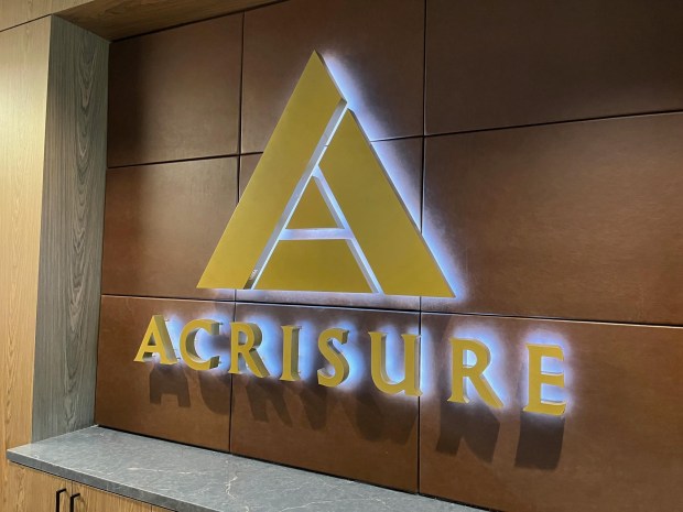 Acrisure logo at the fintech firm's office in One Santana West, an office building totaling 376,000 square feet that is part of the Santana Row mixed-use neighborhood near the corner of Stevens Creek Boulevard and South Winchester Boulevard in San Jose.(George Avalos/Bay Area News Group) Image capture: 4-25-24, San Jose CA