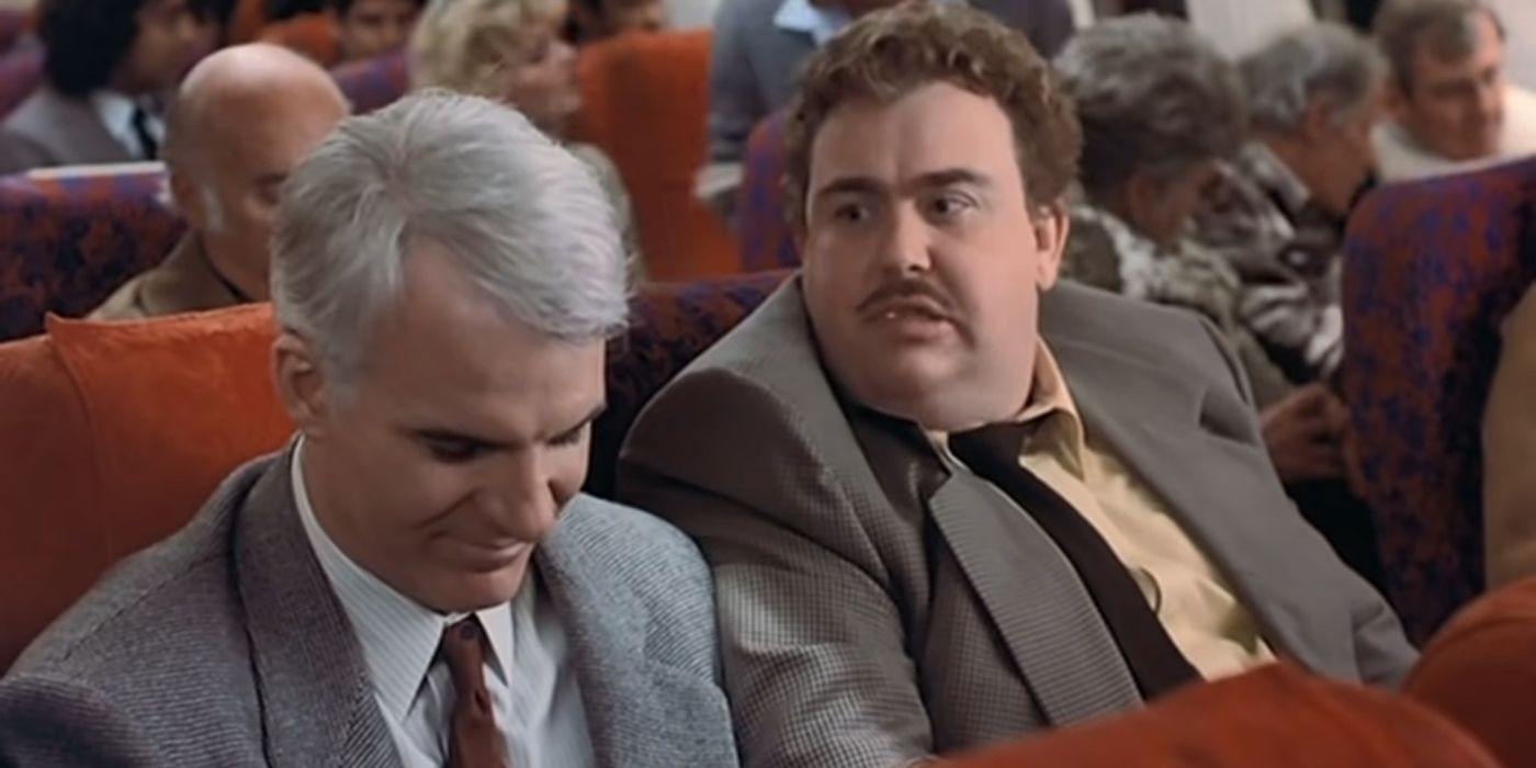 Steve Martin and John Candy in the Planes, Trains, and Automobiles plane scene.