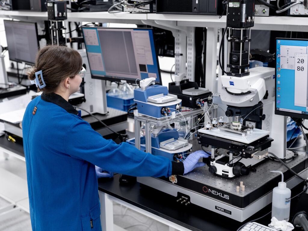 Female scientists works with a microscope in the laboratory.